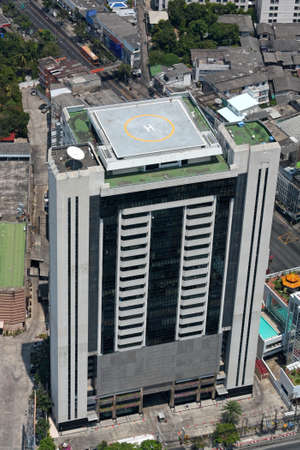 Office building with a helipad on the roof. Top viewの写真素材