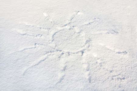 Sun drawn on the fresh snowの写真素材