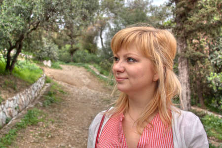 Beautiful blonde young woman portrait outdoorsの写真素材