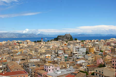 Aerial view of a mediterranean town with a fortress on the background, Kerkyra, Greeceの写真素材
