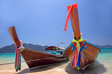 Longtail boats landing in Phi-Phi Island, Thailandの写真素材