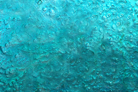 Turquoise abstract background resembling ice or water