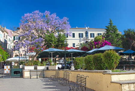 A cozy square with street cafe in a mediterranean townの写真素材