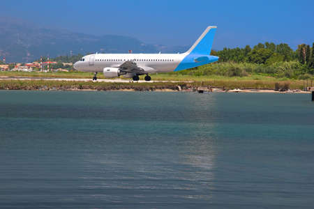 Aircraft landing at a mediterranean island  The airport in Corfu, Greeceの写真素材