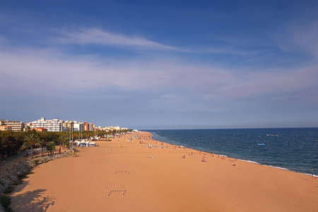Sandy beach in a small european town. Mediterranean summer holydaysの写真素材