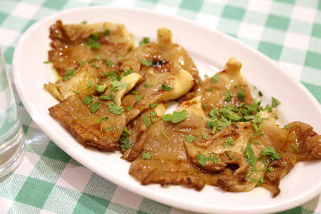 Traditional greek dinner. Grilled mushrooms with greensの写真素材