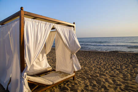 White beach canopies. Luxury beach tents at a resort