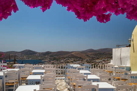 Traditional greek taverna with the view to the sea and mountainsの写真素材