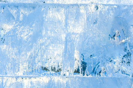 Full frame ice background. Backlit with the sunの写真素材