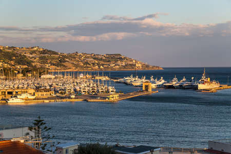 View to a city and a marina at the Mediterranean seaの写真素材
