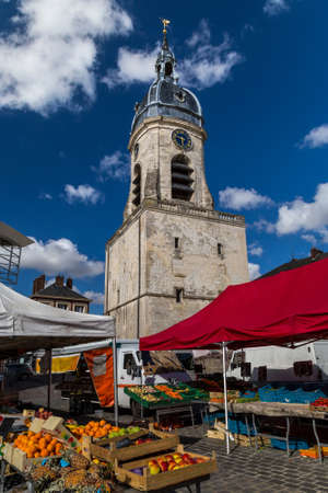 Local market and a bell tower in Amiens, France