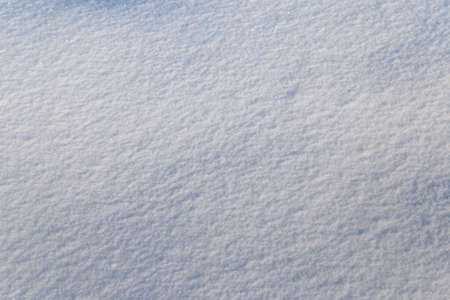 Background of white snow sparkling in the sun. Shallow depth of fieldの写真素材