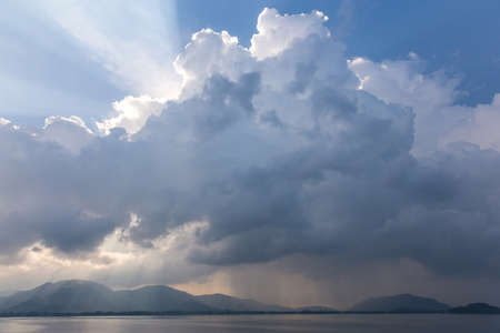 Dramatic clouds early in the morning. View to a tropical islandの写真素材