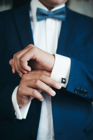 Cuff link, man is getting dressed