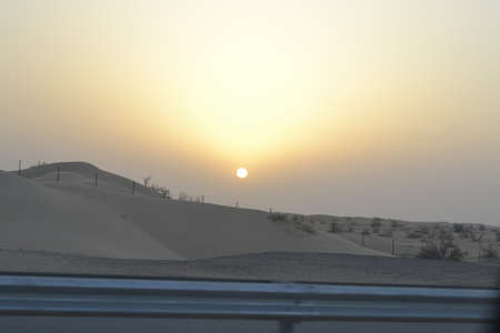 Sunset with sand dunes in desertの写真素材