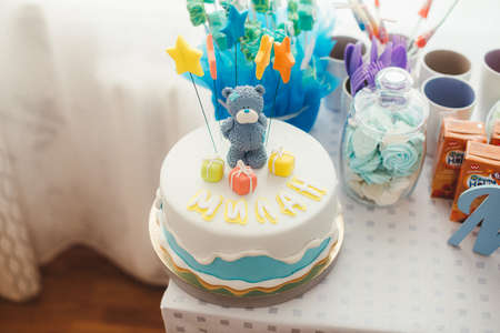 blue cake with a bear and stars