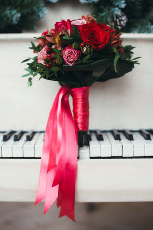 Bridal bouquet of red roses isolated on whiteの写真素材