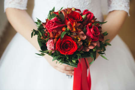 Bridal bouquet of red roses isolated on whiteの写真素材