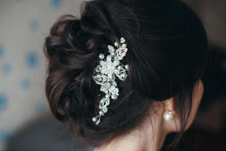 wedding hairstyle, Wedding dress. Wedding decoration. soft selective focus. gorgeous young bride at home. series.の写真素材