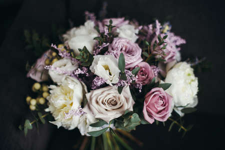 bride bouquet of purple flowersbridal bouquet of white roses and lilacの写真素材