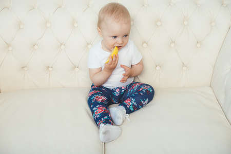 a little girl for the first time trying a lemonの写真素材