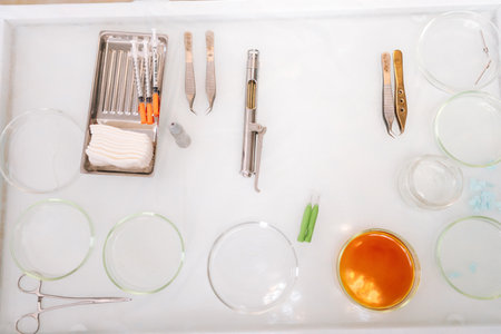 high-angle view of table with any sterile medical instrument in procedure room with light interior,...