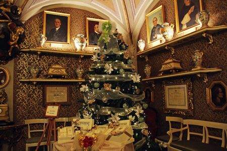 Christmas tree with gifts in retro stylish roomの写真素材