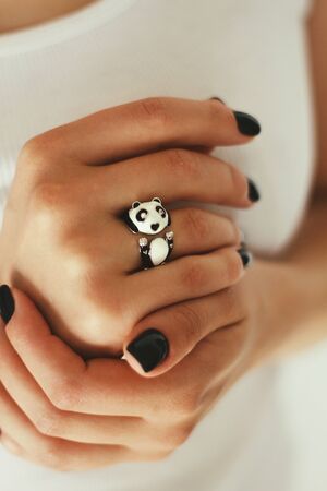 Tender jewelry for female hands, close up shot. Elegance accessories for look and beauty. Rings on fingers in soft light. Gift for relationship. Fashion, love concept.の写真素材