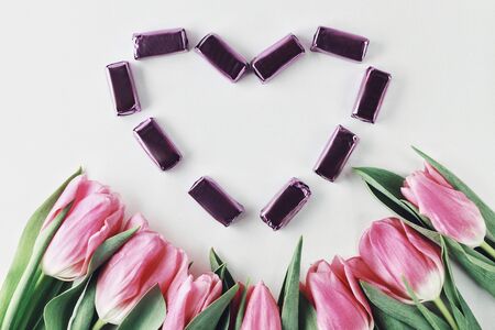 Heart shaped. Beautiful spring flowers bouquet with copyspace for greetings isolated on white...