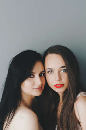 Beautiful young models with bright make-up and long hairの写真素材