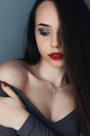 Beautiful young model, longhair girl with bright make-up, red lipsの写真素材