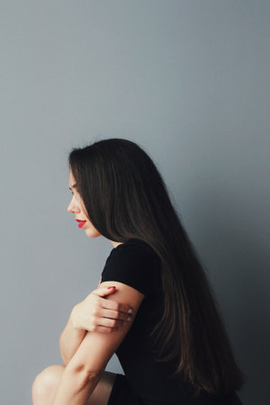 Beautiful young model, longhair girl with bright make-up, red lipsの写真素材