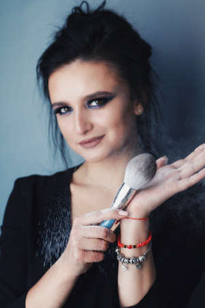 Beautiful young brunette model with bright make-up and long hairの写真素材