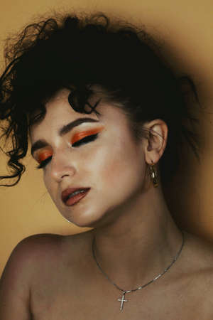 Beautiful young brunette model with bright make-up and long hairの写真素材