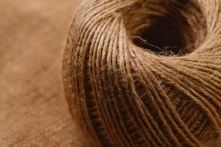 new tangle of cords on sackcloth background.の写真素材