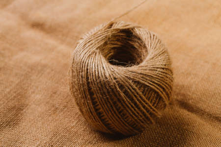 new tangle of cords on sackcloth background.の写真素材