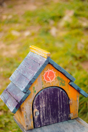 a pretty bird house in the parkの写真素材