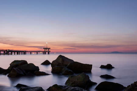 Sunrise over the sea bridge in Burgas bay, Bulgariaの写真素材