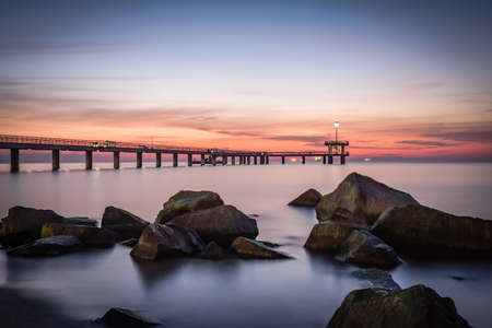 Sunrise over the sea bridge in Burgas bay, Bulgariaの写真素材