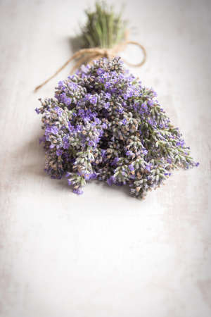 Close up of lavender bouquet over a white wood background. Vintage style.の写真素材