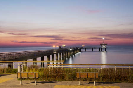 Sunrise over the sea bridge in Burgas bay, Bulgariaの写真素材