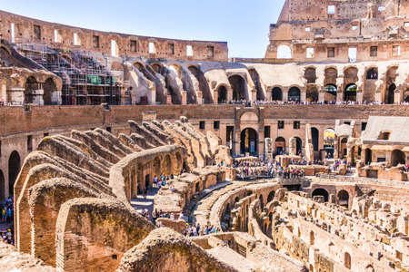 ROME, ITALY - APRIL 24, 2017. Inside view of The Colosseum with tourists sightseeing.