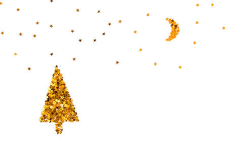 Christmas tree, moon and starry sky made of gold star shaped sequins. White background.の写真素材