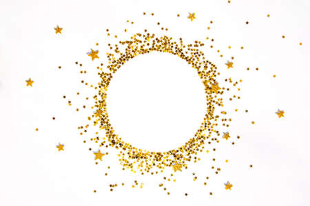 Star shaped golden sequins frame arranged in circle.の写真素材