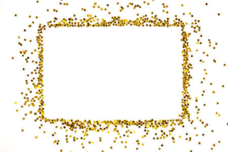 Star shaped golden sequins frame arranged in a rectangular form.の写真素材