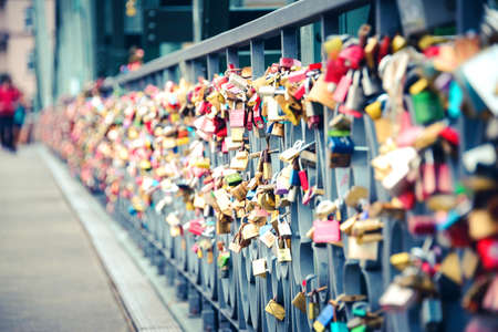 Thousands of love padlocks locked on the rail of Iron Bridge in Frankfurt Um Main.