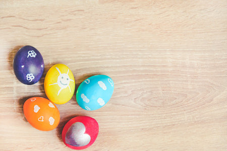 <p>Charmingly colorfully decorated Easter eggs with child's paintings. Funny festive...