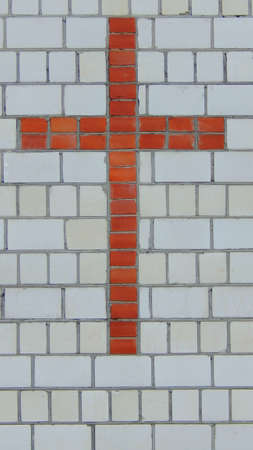 Cross of red brick on Narrow crossの写真素材