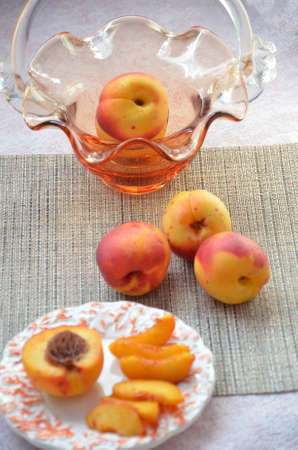 Fresh peaches, Peach close up fruit background, peach on wood background,sweet peaches, group of peaches,sliced peaches, peach slicesの写真素材