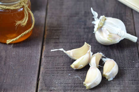 Garlic and honey, fresh and healthy food products, concept for healthy nutrition and strengthening immunityの写真素材